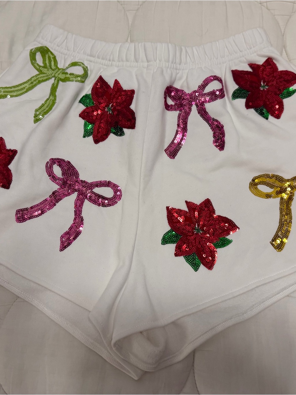 QUEEN OF SPARKLES White Sequin Poinsettia & Bow Embellished Shorts